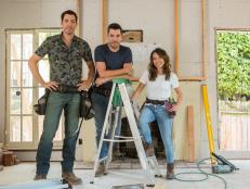 Drew Scott, fiancé Linda Phan, and Jonathan Scott pause in the living room, as seen on Property Brothers at Home: Drew’s Honeymoon House.