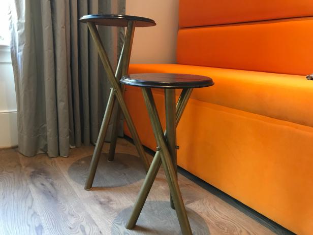 Dining Area with Copper Pedestal Tables and Orange Benches
