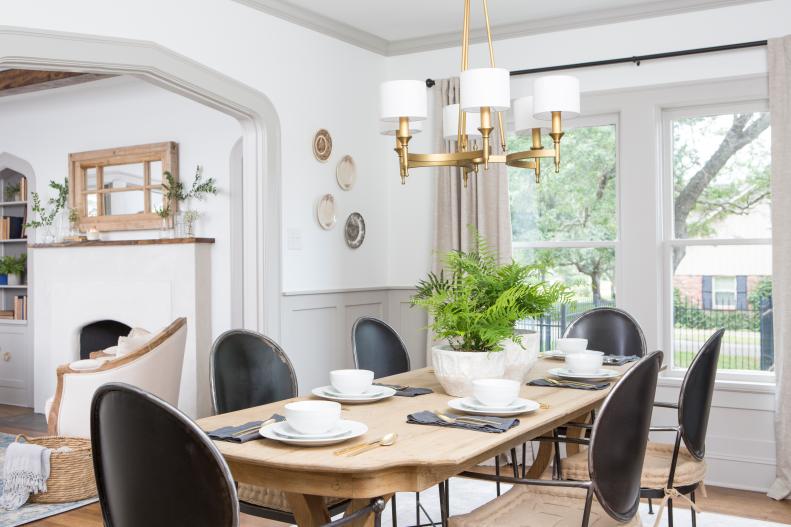 Neutral Dining Room with Wooden Farm Table and Black Chairs 