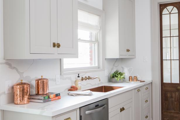 Neutral Kitchen with White Marble Backsplash 