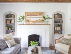 White Living Room with Neutral Exposed Beams and White Fireplace