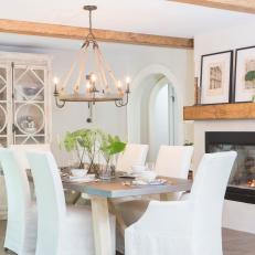 Neutral Rustic Dining Room with Glass Fireplace 