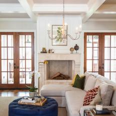 Neutral Transitional Living Room With Blue Ottoman