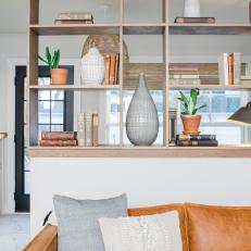 Contemporary Neutral Family Room with Brown Built-In Shelf 