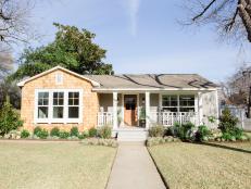 The exterior of the Baker's renovated home has new siding, landscaping and an updated porch, as seen on Fixer Upper. (After #1)