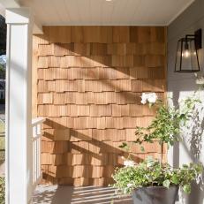 Neutral Cottage Patio with Brown Wood Siding 