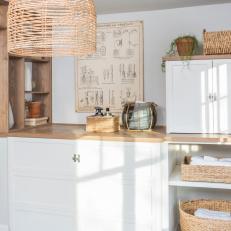 Neutral Cottage Laundry Room with White Custom Cabinets 