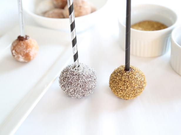 Repeat process with remaining donut holes using various metallic sugars and dragees. Allow to dry completely on the parchment paper, about 20 minutes. You may also speed setting by placing them in the refrigerator.