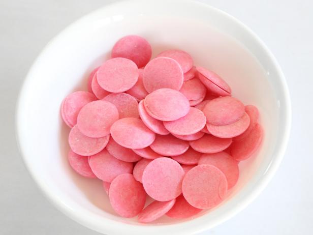 Place the pink and teal candy melting wafers in separate heat-proof bowls. Microwave each bowl at 30 second intervals at 100% power, until the candy can be stirred smooth. 