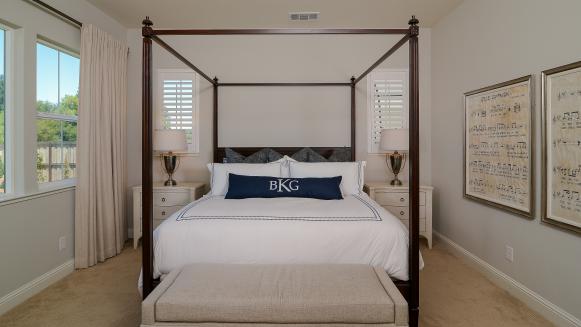 Wood Four-Poster Bed With Canopy in Neutral Bedroom