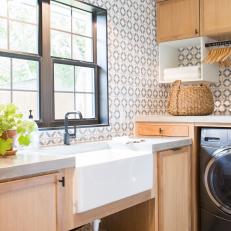 Contemporary Neutral Laundry Room with Black and White Tile Backsplah 