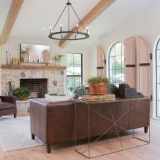 Contemporary Neutral Living Room with Brown Exposed Ceiling Beams 