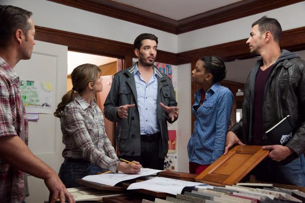 As seen on HGTV's Brother vs. Brother, host Jonathan Scott, center, talks with his team (from left) Rick Schwarz, Stayce Smith, Peggy Tart, and Adi Shuruk in the dining room of the Espy house as they pick project rooms and talk about the budget. Ultimately the group decided to remodel the kitchen and the upstairs bathroom. Jonathan reminded his team that it was crucial that they finish whichever project areas they started, since they hadn't managed to complete all of the finish work in the last challenge. (Action)