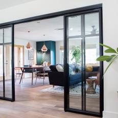 Neutral Midcentury Modern Living Room with Black Sliding Doors 