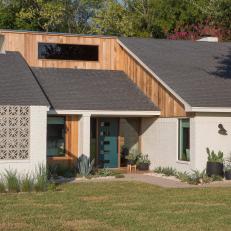 Neutral Midcentury Modern Home Exterior with a Gray Privacy Wall