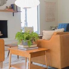 Neutral Midcentury Modern Living Room with a Wooden Neutral End Table 