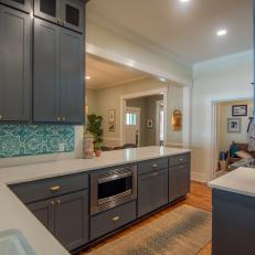 Contemporary Gray Kitchen with White Stone Countertops 