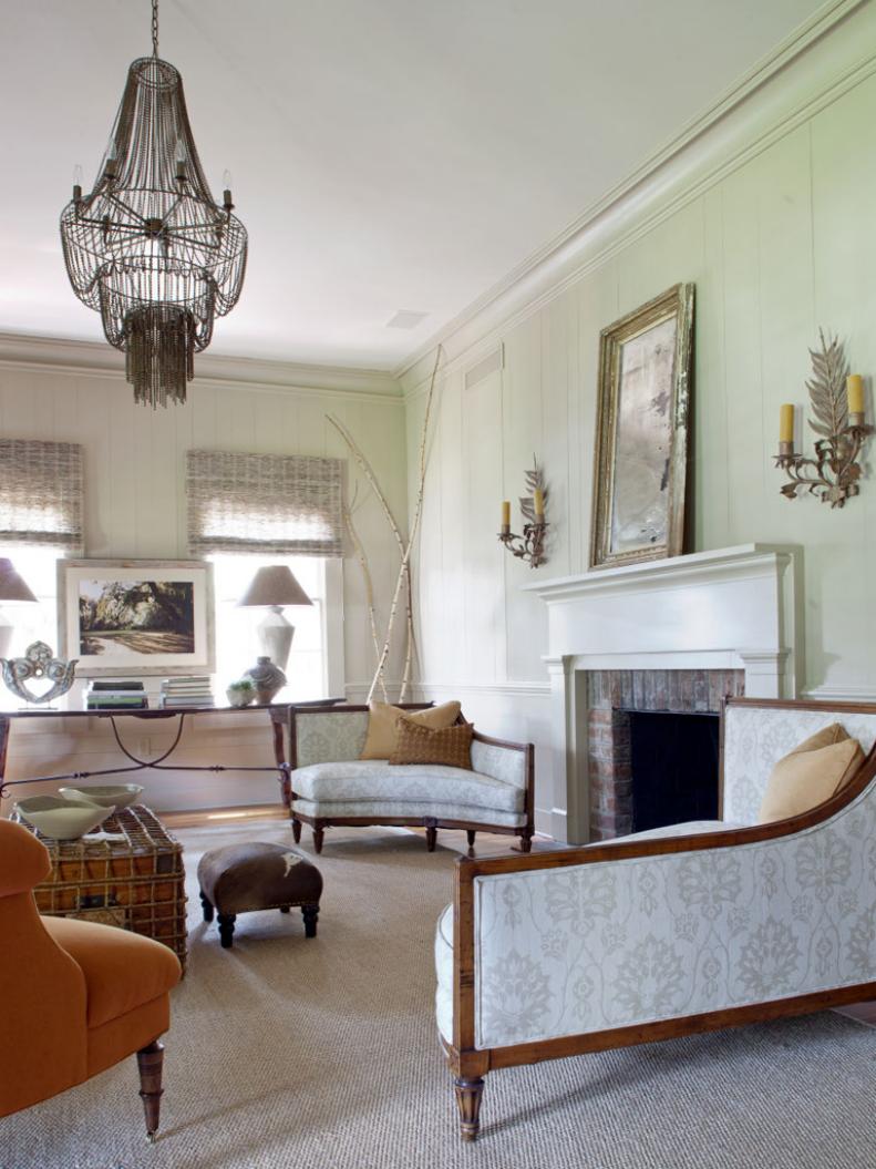 Metal Chandelier Hanging Above Living Room Sitting Area