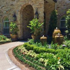 Front Walkway and Garden With Fountains