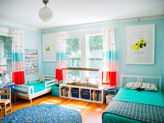 This space hosts the two Stansell boys, who share this bedroom that could also be described as their own little well-curated museum of interests. Their personalities and evidence of their adventures are proudly displayed around their room. If you look closely you’ll spy that at least one of the boys is a budding chef. They also have a small family of hamsters between them, and they love yellow tractors. The boys’ room is a really good example of how I approach kids' spaces: always go monochromatic with walls and bedding. Between their toys, books, art, rugs, etc. there will be plenty of opportunity for stimulation/adding interest without becoming too busy. My fave in the room? The drapes are perfectly appointed: they look fun and put an exclamation point on the entire space.