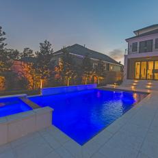 Backyard and Glowing Blue Pool