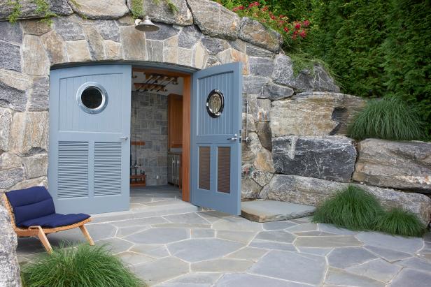 Outdoor Storage Concealed in Natural Stone Archway With 