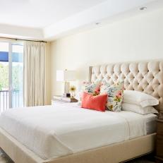 Neutral Transitional Bedroom With Tufted Headboard