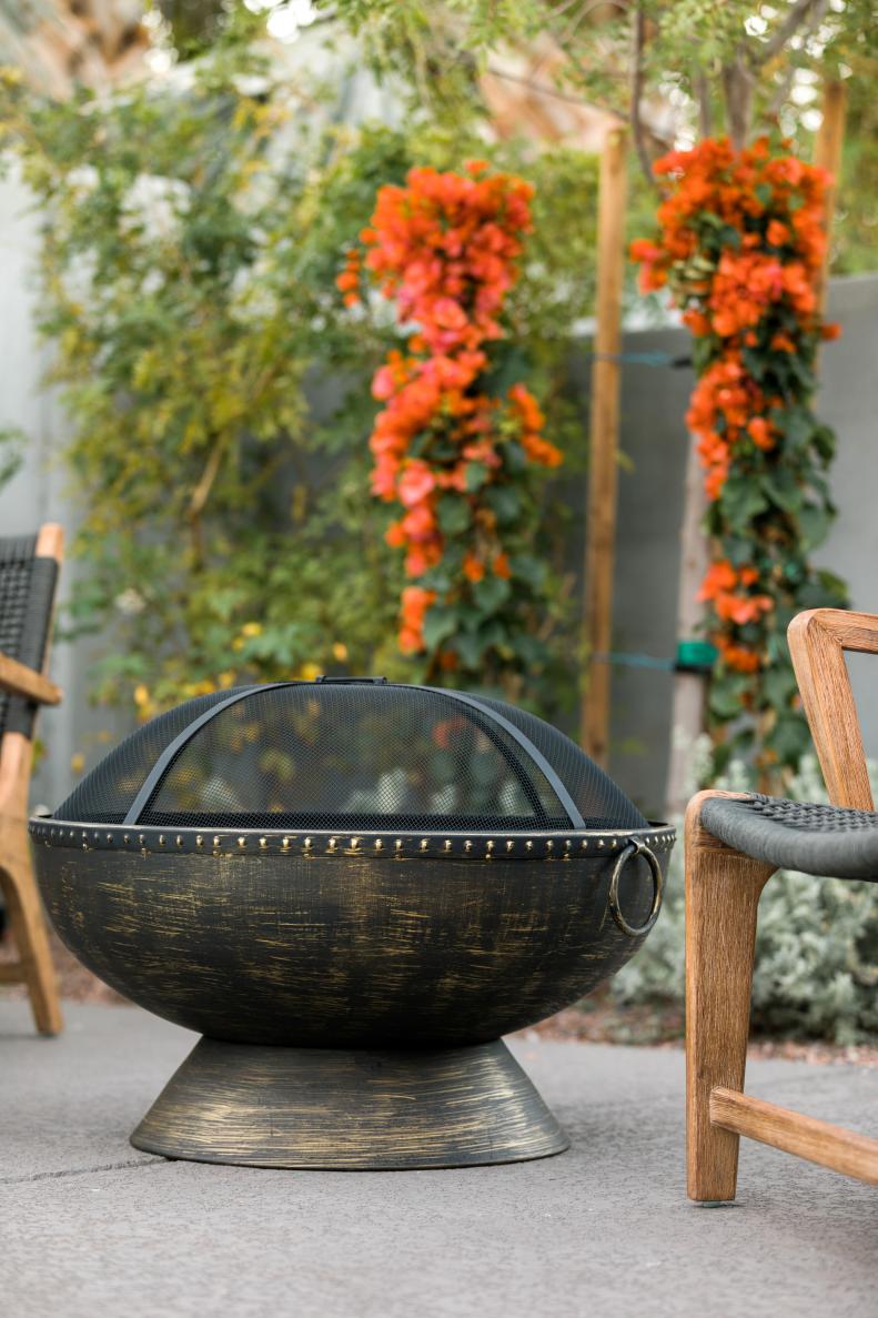 HGTV Spring House 2017: Metal bowl-shaped fire pit on patio