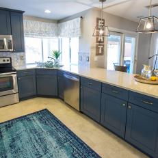 Blue Open Plan Kitchen With Rug