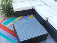 Give a drab gray rug the color treatment with paint samples and tape. With a few colors or a lot of colors, this pattern offers infinite ways to add a punch to your patio.