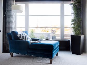 Master bedroom's blue chaise lounge offers a great view