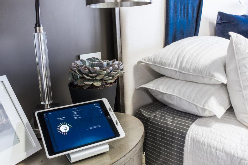Inductive charging station in master bedroom keeps home's tablet ready