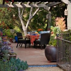 Shady Mediterranean Arbor With Dining Table