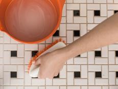Baking soda paired with warm water and bleach will knock out stubborn grout stains on tile floors and walls. If you need a heavy-duty cleaning, amp up the bleach but wear gloves to protect that manicure.