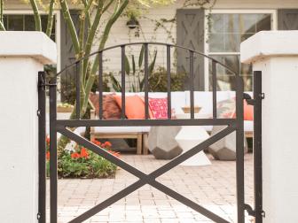 Nothing makes a walkway or entry more polished and secure than a good-looking gate. Consider a solid planked gate if you prefer privacy or have kids and pets.  