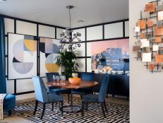 A formal entertaining space infused with chic modern elements, the dining room opens out to the great room, with graphic wall coverings that elevate the design.
