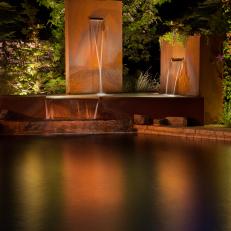 Corten Steel Water Feature Connected to Pool