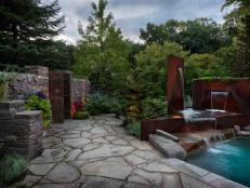 Flagstone Patio With Modern Water Feature and Pool