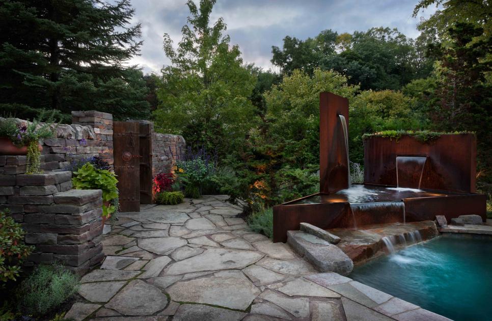Cozy Patio With Cushioned Seating, Fire Pit and Water Feature
