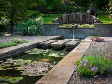 Koi Pond With Waterfall and Gravel Patio