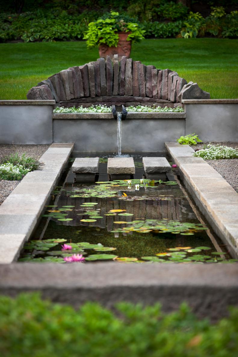 Koi Pond With Waterfall and Stone Pavers