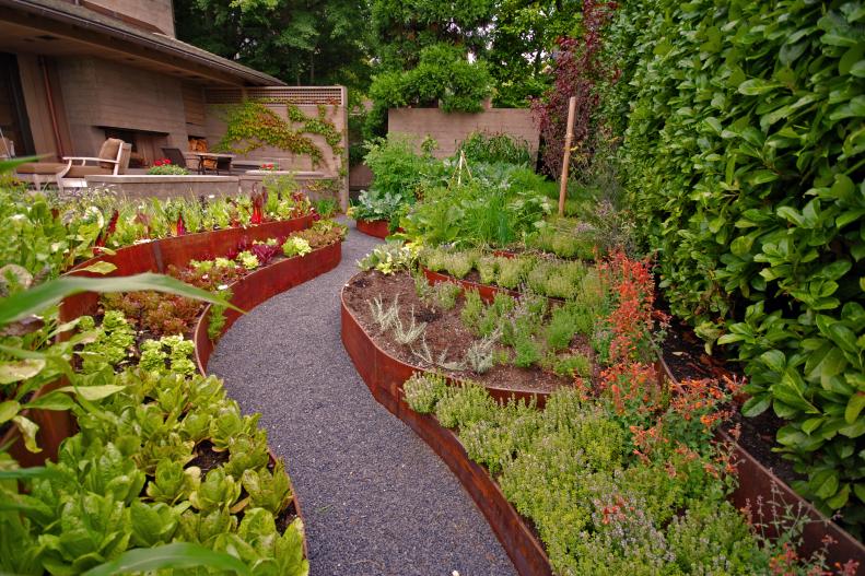 Contemporary Garden With Corten Metal Retaining Walls