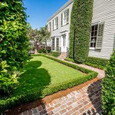 Brick Courtyard With Well-Manicured Lawn