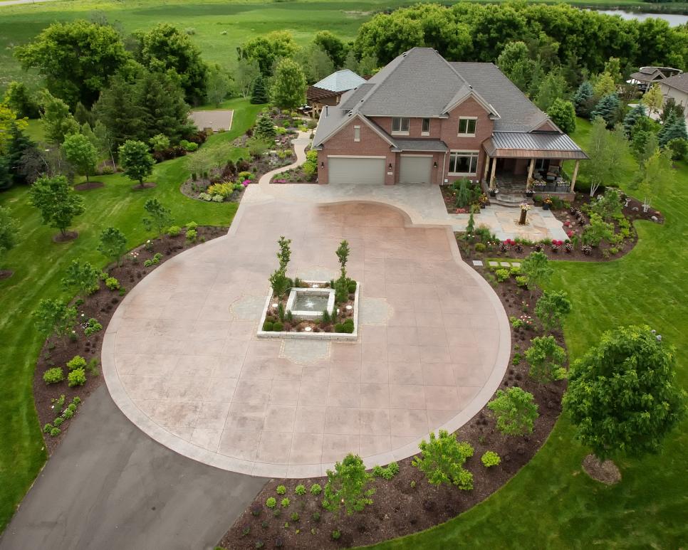 Grand Home Entrance Featuring Large Circular Driveway, Water Feature