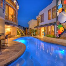 Cool, Contemporary Pool With Colorful Outdoor Art
