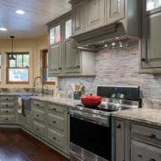 Neutral Country Kitchen With Distressed Green Cabinets