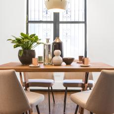 Copper and Wood Dining Table With Plant