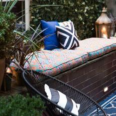 Eclectic Outdoor Space Includes Cushioned Bench, Copper Lanterns
