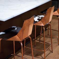 Eclectic Kitchen With Cowhide and Copper Barstools