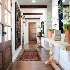 Light and Bright Foyer With Custom Console Tables and Exposed Beam Ceiling